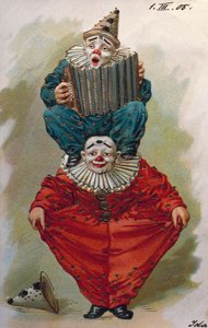Zwei Clowns, einer spielt Akkordeon