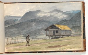 Gebirgslandschaft mit Hütte und Wanderer