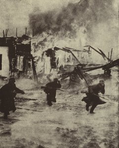 Deutsche Soldaten marschieren durch die brennenden Ruinen von Rotterdam nach der Bombardierung durch die Luftwaffe, Zweiter Weltkrieg, Mai 1940 von Photographer German