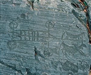 Prähistorie: Camunni-Zivilisation: ein von Pferden gezogener Wagen, Räder sind mit Speichen dargestellt und Pferde sind im Profil in einem Versuch der Perspektive. Felsgravur von Fels 23 von Naquane (Valcamonica, Val Camonica, Brescia). Zeitraum zwischen N