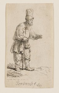 Ein Bauer mit hoher Mütze, stehend und auf einen Stock gelehnt von Rembrandt van Rijn