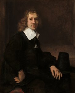Ein junger Mann sitzt an einem Tisch, möglicherweise Govaert Flinck