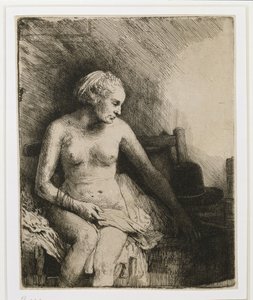Eine Frau beim Bad mit einem Hut neben ihr von Rembrandt van Rijn