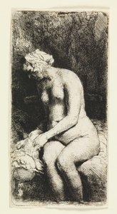 Frau, die ihre Füße an einem Bach badet von Rembrandt van Rijn