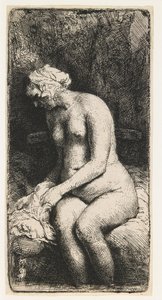 Frau, die ihre Füße an einem Bach badet von Rembrandt van Rijn