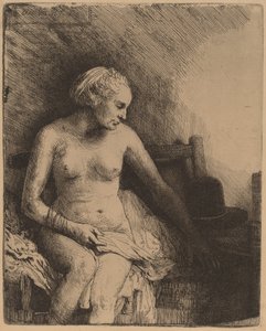 Frau beim Bad mit einem Hut neben ihr von Rembrandt van Rijn