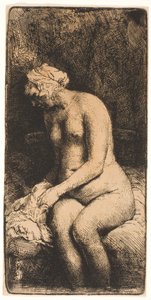 Frau, die ihre Füße an einem Bach badet von Rembrandt van Rijn