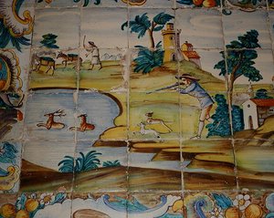 Azulejos-Fliesen, die einen Jäger darstellen, der auf Hirsche schießt