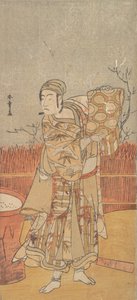 Der Schauspieler Sawamura Sojuro III hält ein Stück Brokat hoch