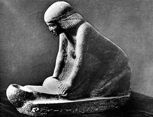 Ägyptische Grabfigur einer Frau, die mit einem Sattelquern Korn mahlt, ca. 2500 v. Chr. von Unbekannt