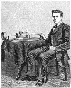 Thomas Alva Edison, amerikanischer Erfinder, mit einem frühen handbetriebenen Modell seines Phonographen