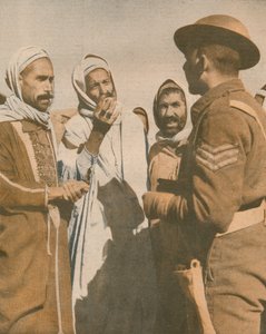 Tunesische Araber begrüßen einen britischen Sergeant in Chaouach, 1943