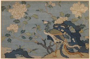 Phönix zwischen Felsen und Blumen