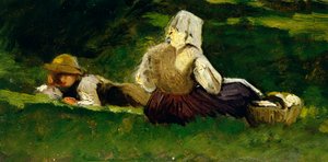 Sitzende Frau und Junge auf dem Gras liegend