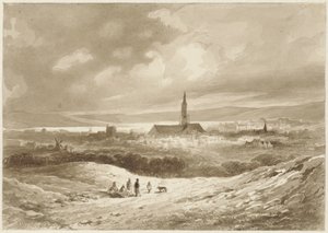 Blick von den Hügeln auf eine Stadt an einem See