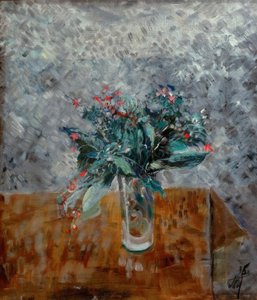 Blumen in einem hohen Glas