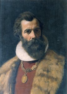 Bärtiger Mann mit Pelzkragen und Kette