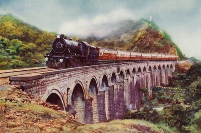 4-6-2 Dampflokomotive der Bombay, Baroda und Central India Railway, die den Frontier Mail über ein Viadukt zwischen Bombay und Delhi zieht von English School