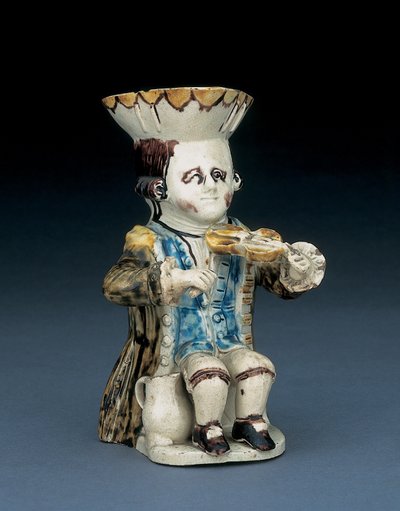 Fiedler Toby Krug, sein Hut mit braunem und gelbem gewelltem Rand, sein braunes Haar eingeschnitten und mit einer weißen Rosette gebunden, in einem gewaschenen braunen Frack, ca. 1770 von English School