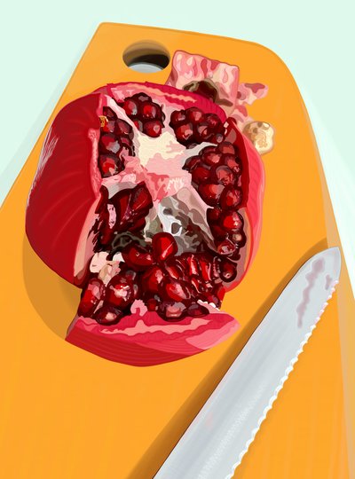 Geschnittene Granatapfel und Messer auf Schneidebrett von Evan Sklar