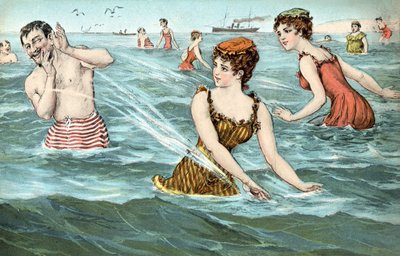 Mädchen spritzen einen Mann im Meer nass von French School