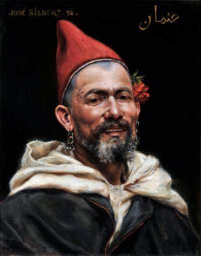 Kopf eines Marokkaners mit durchstochenen Ohren und rotem Hut, mit einer Blume im Ohr und einem Tattoo auf der Schläfe, 1892 von Jose Silbert