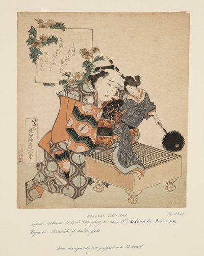 Puppenspieler, der eine Puppe auf einem Go-Brett hält von Katsushika Hokusai