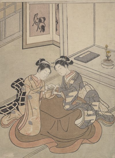 Zwei junge Frauen, die an einem Kotatsu sitzen und Fadenspiele spielen, ca. 1765 von Suzuki Harunobu