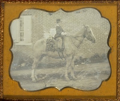 Junge mit Hut auf einem Pferd von Unknown artist