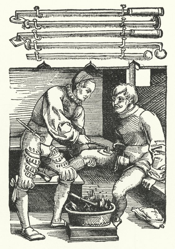 Ein Chirurg kauterisiert die Beinwunde eines Soldaten von German School
