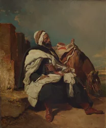 Sitzender arabischer Mann mit Pferd