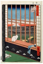 Eine Katze sitzt auf dem Fenstersitz