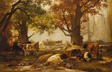 Rinder in einer bewaldeten Flusslandschaft