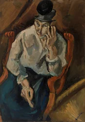 Frau, die in einem Sessel sitzt