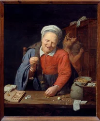 Der Goldwäger. Eine alte Frau wiegt Goldstücke auf einer kleinen Waage, während im Hintergrund ein Mann mit einem Eberkopf Säcke im Schrank verstaut. Gemälde von David III Ryckaert (1612-1661)