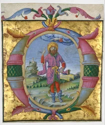 David mit seinem Fuß in einer Schlinge in einem Initial O