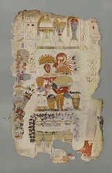 Ein Tisch mit Grabbeigaben, mit Obst, Blumen, Süßigkeiten usw. und Weinkrügen daneben