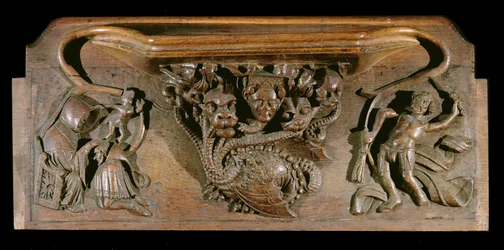 Eine Miserikordie, die eine kunstvoll geschnitzte Hydra darstellt, symbolisch für die sieben Todsünden, mit einem realistischen menschlichen Kopf, New College Chapel, Oxford, spätes 14. Jahrhundert