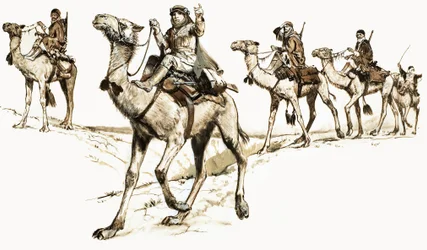Araber überqueren die Wüste auf Kamelen