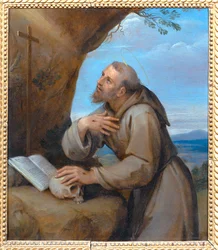 Heiliger Franziskus von Assisi im Gebet vor einem Kruzifix