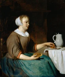 Junge Frau beim Essen an einem Tisch