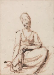 Sitzende Frau, die ein Tier füttert