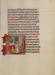 Initial G: Ein Priester feiert die Messe