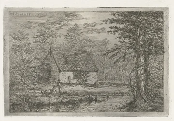 Ehepaar mit Hund bei einer Scheune