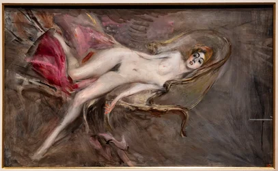 Nackte Frau auf rosa Kissen