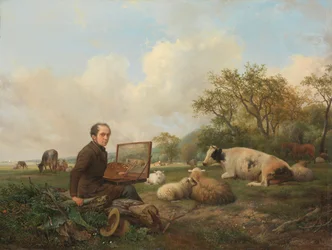 Der Künstler malt eine Kuh auf einer Wiese