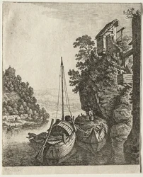 Zwei unter einem Felsen vertäute Boote