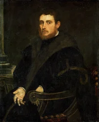 Junger Mann mit rotem Bart in einem Sessel