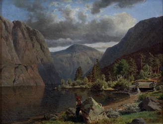 Mann in Fjordlandschaft