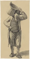 Stehender Mann mit einem Korb auf der Schulter